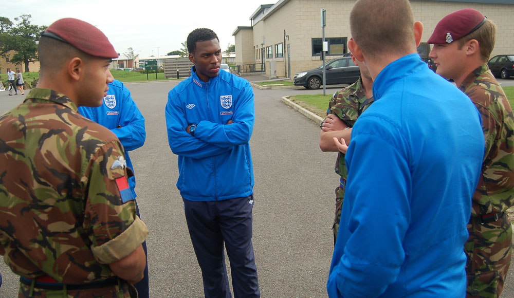 Daniel Sturridge listens to the 'real heroes'.